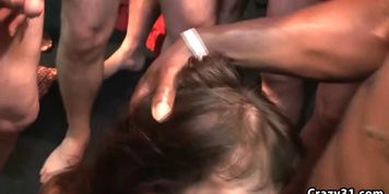 Busty slut gets showered with jizz in bukkake porn