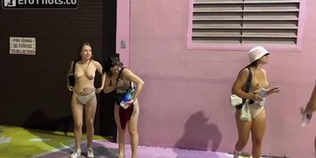 Four girls peeing in alleyway