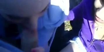 2 girls sucking dick outside