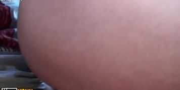 Attractive girl is sucking rough cock sitting in the grass so no one can see them