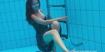 Brunette tight girl in the pool