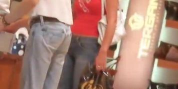 Slim tanned hot brunette with camel toe shopping street candid