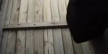 Woman changing in beach cabin
