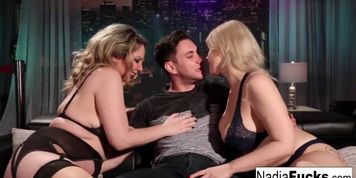Sexy club goers double team a big cock
