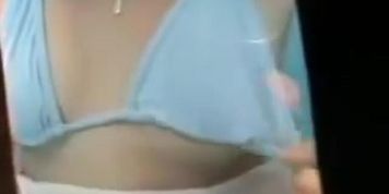 Dark nippled boobs were voyeured in the beach cabin