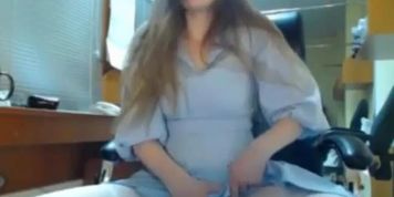 this girl is bored at work and decides to masturbate