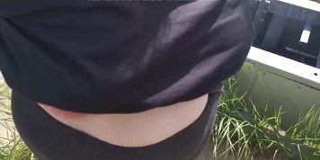 Tit slapping in front of cellphone tower