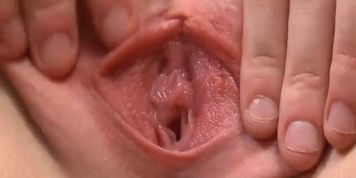 Lovely teenie is opening up wet snatch in closeup and getting off