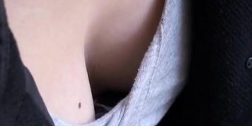 Japanese girl lets downblouse camera take a shot