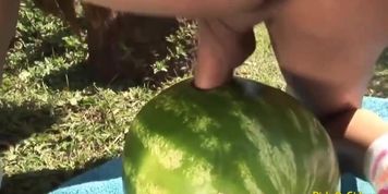 Shemale fucks a watermelon