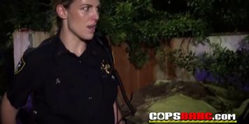 Nasty female cops take a black guy to the darkness to fuck