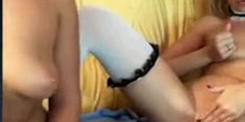 Busty lesbian shows her tits while her girlfriend masturbates