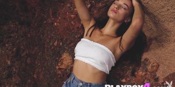 Amazing brunette model Gloria Sol posing outdoor before passion striptease