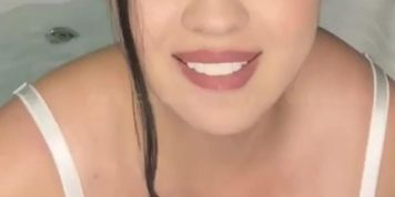 Latina in white lingerie masturbates with a vibrator