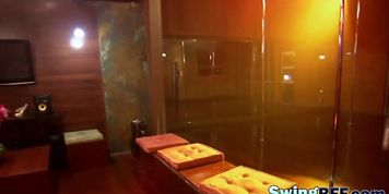Swinger couples enjoying striptease in mansion