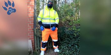 quick pawing off in hi-vis tracksuit and sneakers outdoors