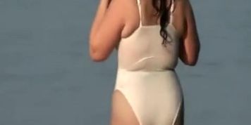 Chubby lady going into the sea