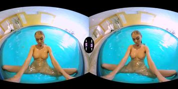 Blonde enjoys solo play in a pool