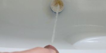 Piss into small tea cup and making it overflow