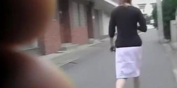 Sharking of graceful Japanese girl wearing a white skirt