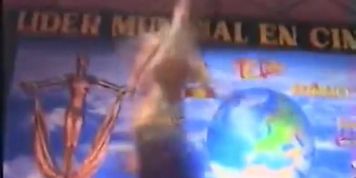 Beautiful woman dancing naked in front of huge crowd