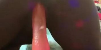 Ebony creams all over pink dildo