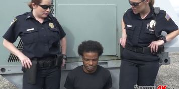 Putting hard a big black cock is a duty that only the two horny cops know how to do it better