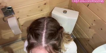 Schoolgirl practices oral skills in private bathroom setting