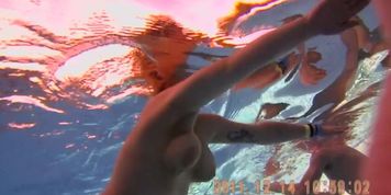 Voyeur cam shooting babes nude clefts under the water