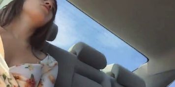 Lady flashes in the back of the Uber ride
