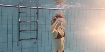 Nastya hot blonde naked in the pool