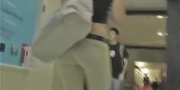 A brunette with appetizing ass in the street candid video