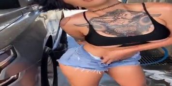 Dylan Phoenix washes a car in shorts and shows off her sexy legs