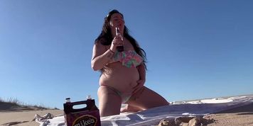 Feedee burping and belly play at beach