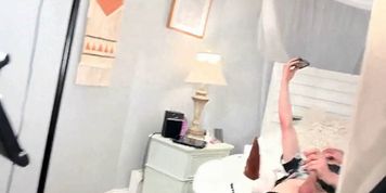 Heather C Payne giving a blowjob in a sexy black fishnet lingerie