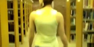 Naked girl in library