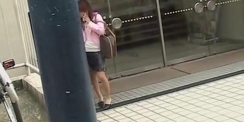 Occupied with the phone and a bicycle she got skirt sharked