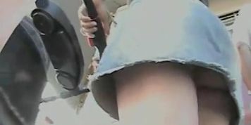 Curvy blonde MILF exposes her upskirt thong and ass