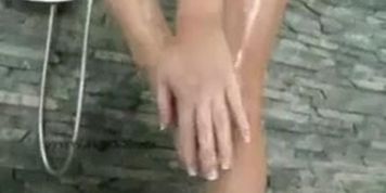 Kinky girl naked at shower playing
