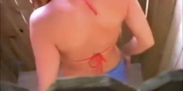 Beach cabin hidden cam scenes with doll in red bikini