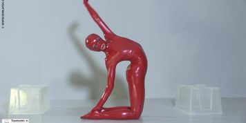 Flexible slut in a red latex catsuit