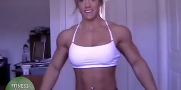 Muscle girl Cindy Phillips posing and flexing her ripped body on webcam
