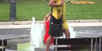 Busty girl walking naked in fountain