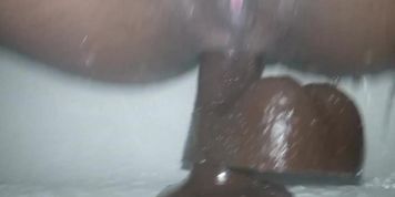 Quick shower fuck...bouncing on big black dildo (Nubiles)