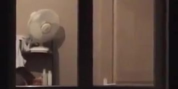 Spying on neighbour while she changes