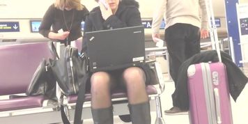 blond business woman upskirt at airport
