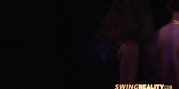 Open minded swinger couples are having a wild orgy in the red room.
