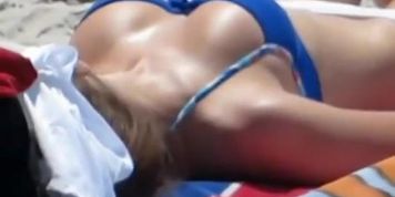 Hot brunette with nice body sunbathing