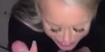 Gives a mean blowjob in public
