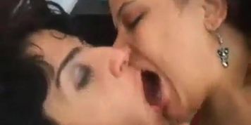 Lounging Brunettes Kissing and Grinding